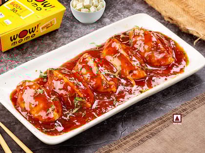 Chicken Cheese Pan Fried Momo In Schezwan Sauce (Spicy)