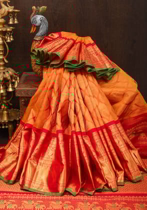 Orange Exquisite Brocade Gadwal with width Contrast Borders in Red | SILK MARK CERTIFIED