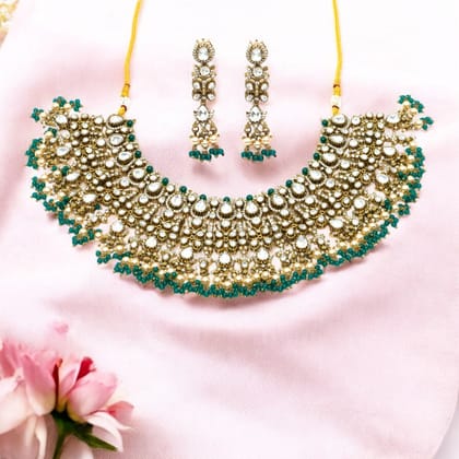 Gold-Plated Kundan Choker Necklace Set with Emerald Bead Detailing