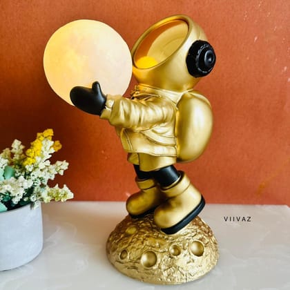 Headphone Astronaut Holding Moon-Golden / Polyresin | Acrylic / H: 12 | L: 9 | W: 6 (lnch)