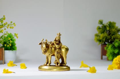 Brass Idol of Krishna Playing Flute with Cow (Color - Golden, Size - 6H * 5L * 3.5B) by Snova Enterprises