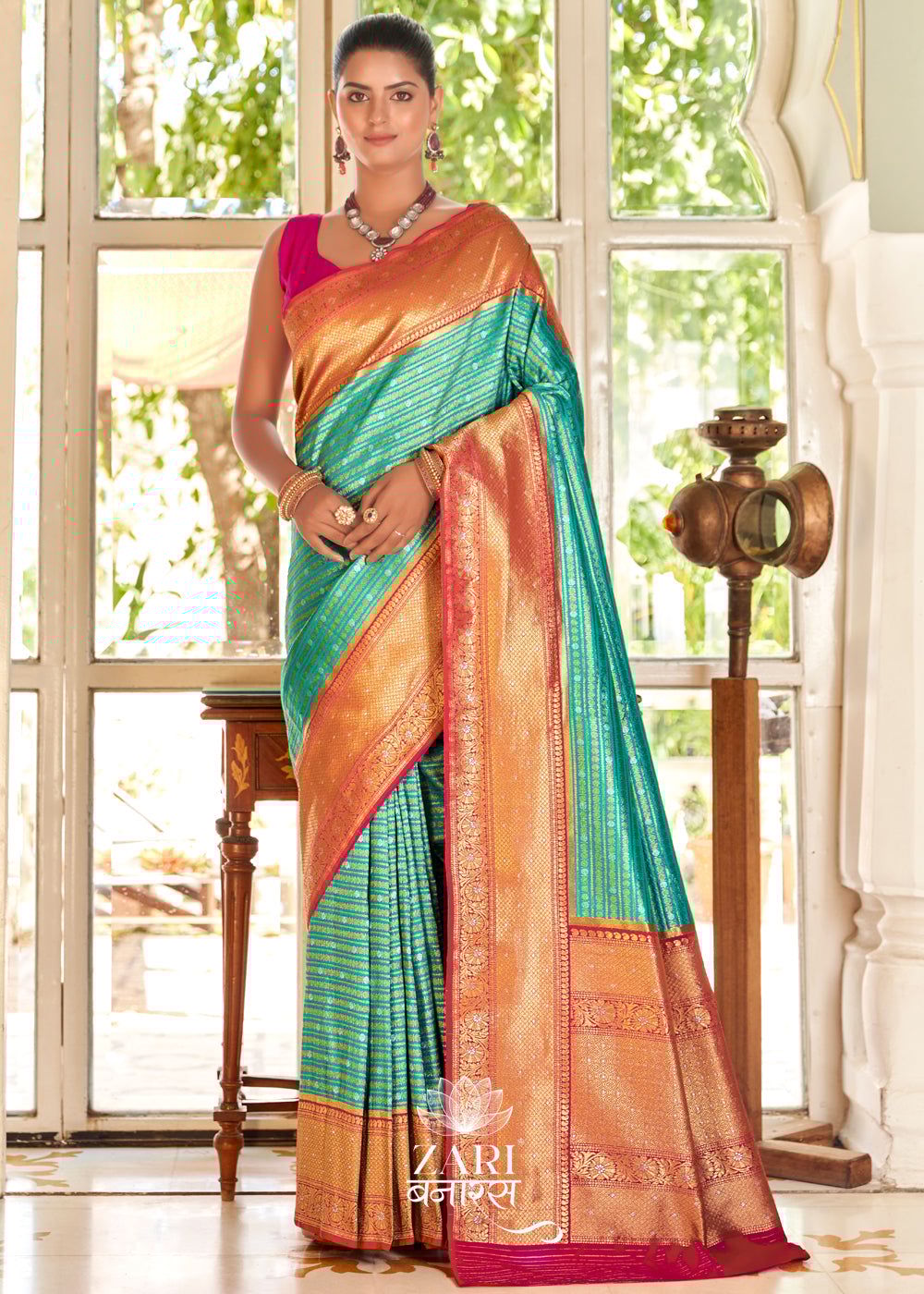Ananda : Silver and Gold Zari Striped Kanjivaram Saree in the Shades of Blue and Red