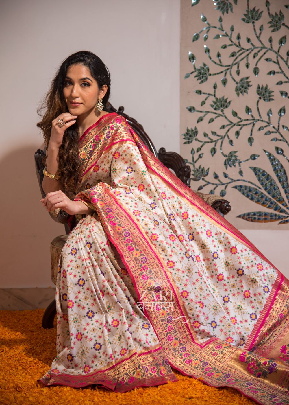 Rani Baagh: Double Ikat Patan Patola Saree And Meenakari Banarasi Border With Mughal Butas In The Shades Of White And Pink