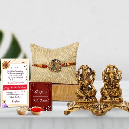 Designer Peacock Rakhi with Golden Goddess Laxmi With Lord Ganesha Idol Metal Decorative Showpiece with Diya and Roli Chawal Pack, Best Wishes Greeting Card