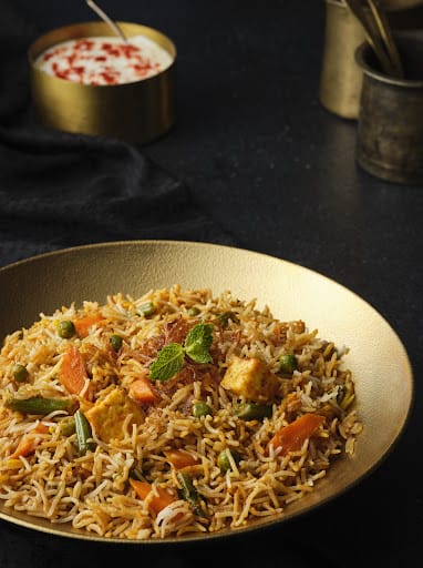 Veg Dum Biryani Served Raita & Salad