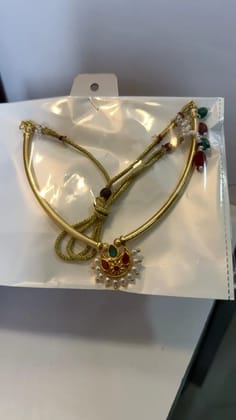 Micro gold polish sari necklace.
