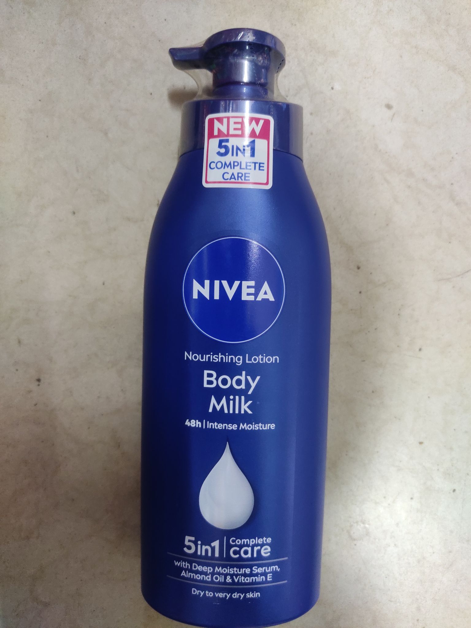 Nivea Nourishing lotion Body Milk 48h | intense moisture Care 5in1 With deep moisture serum, Almond oil & vitamin e 