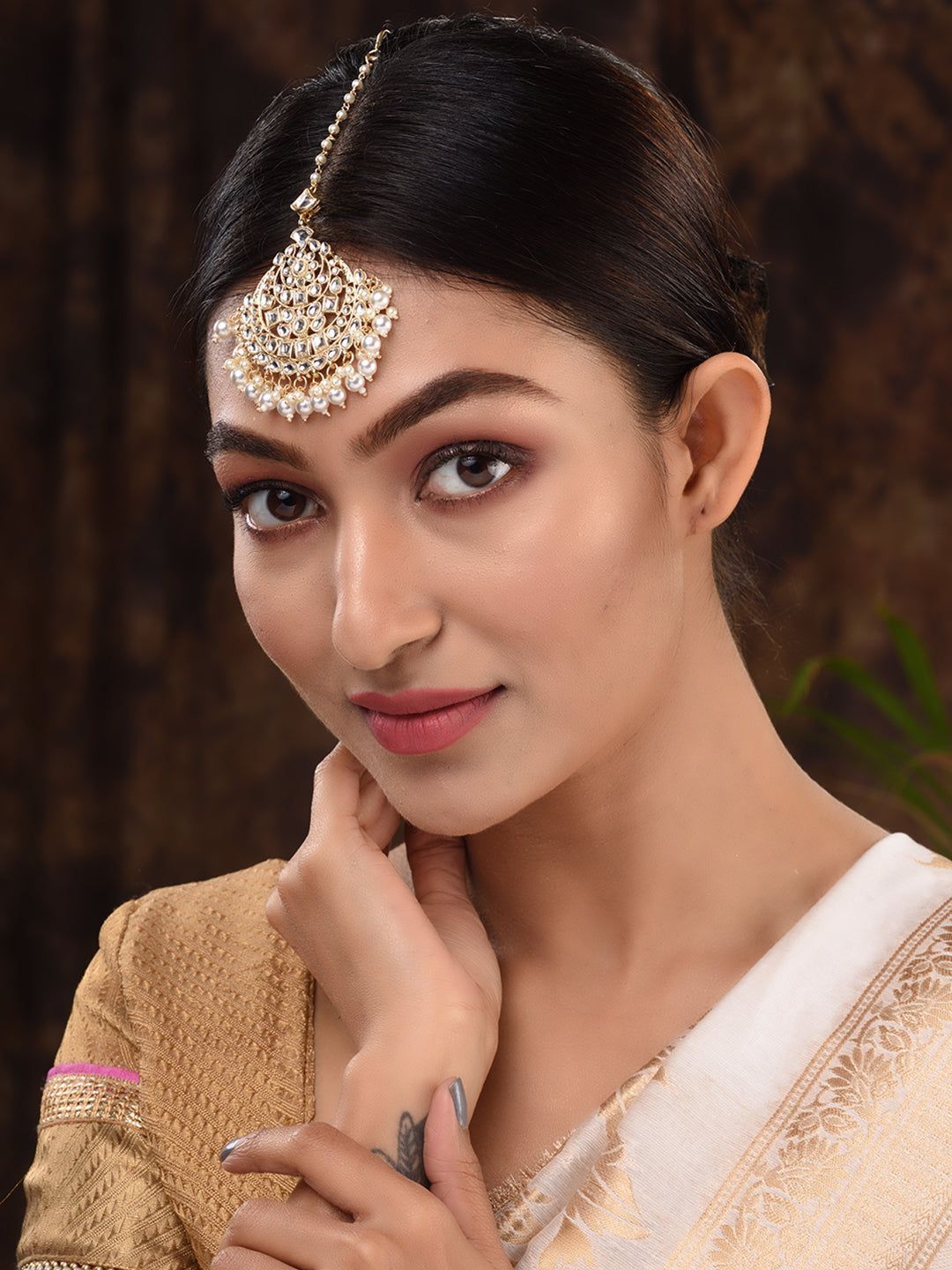 Gold Toned Kundan studded & pearl beadded Cresent shaped Maangtika