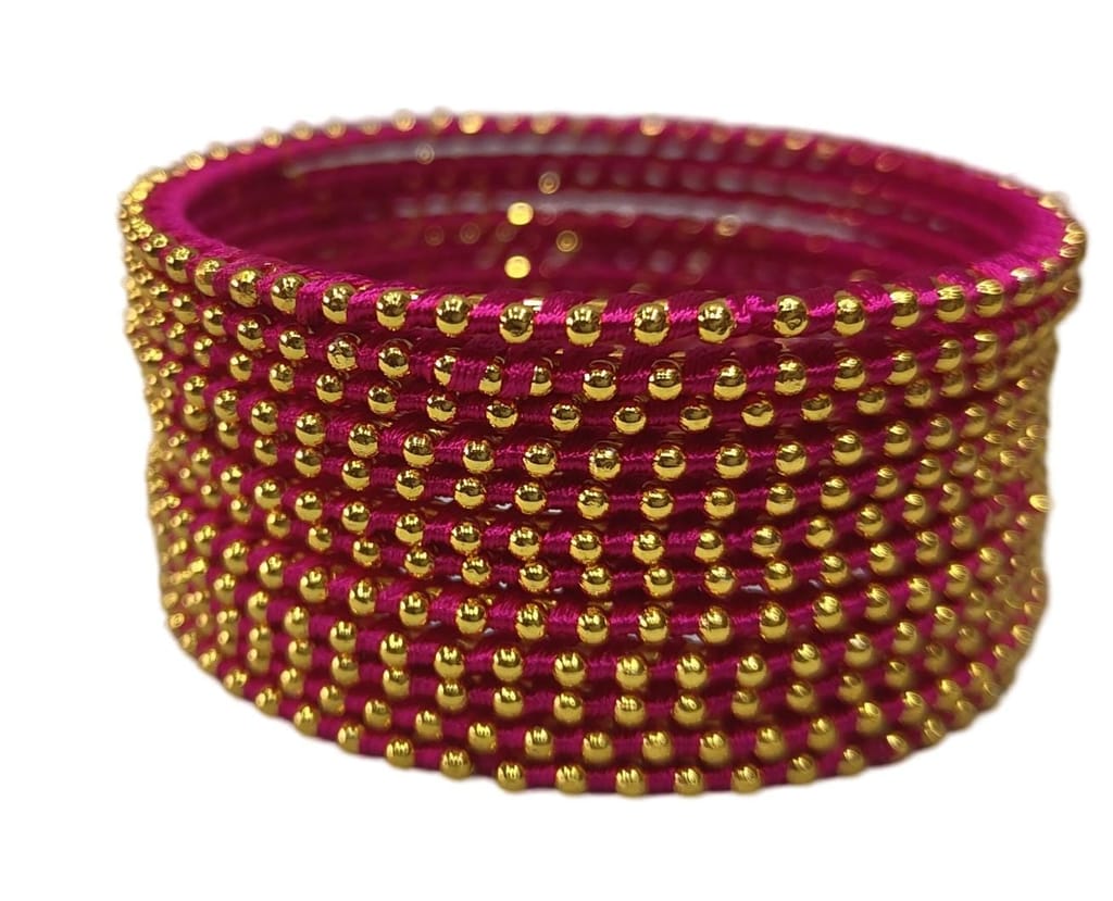 **Set of 8 bangles, pink color with golden beads, traditional Indian jewelry, perfect for weddings and festivals.