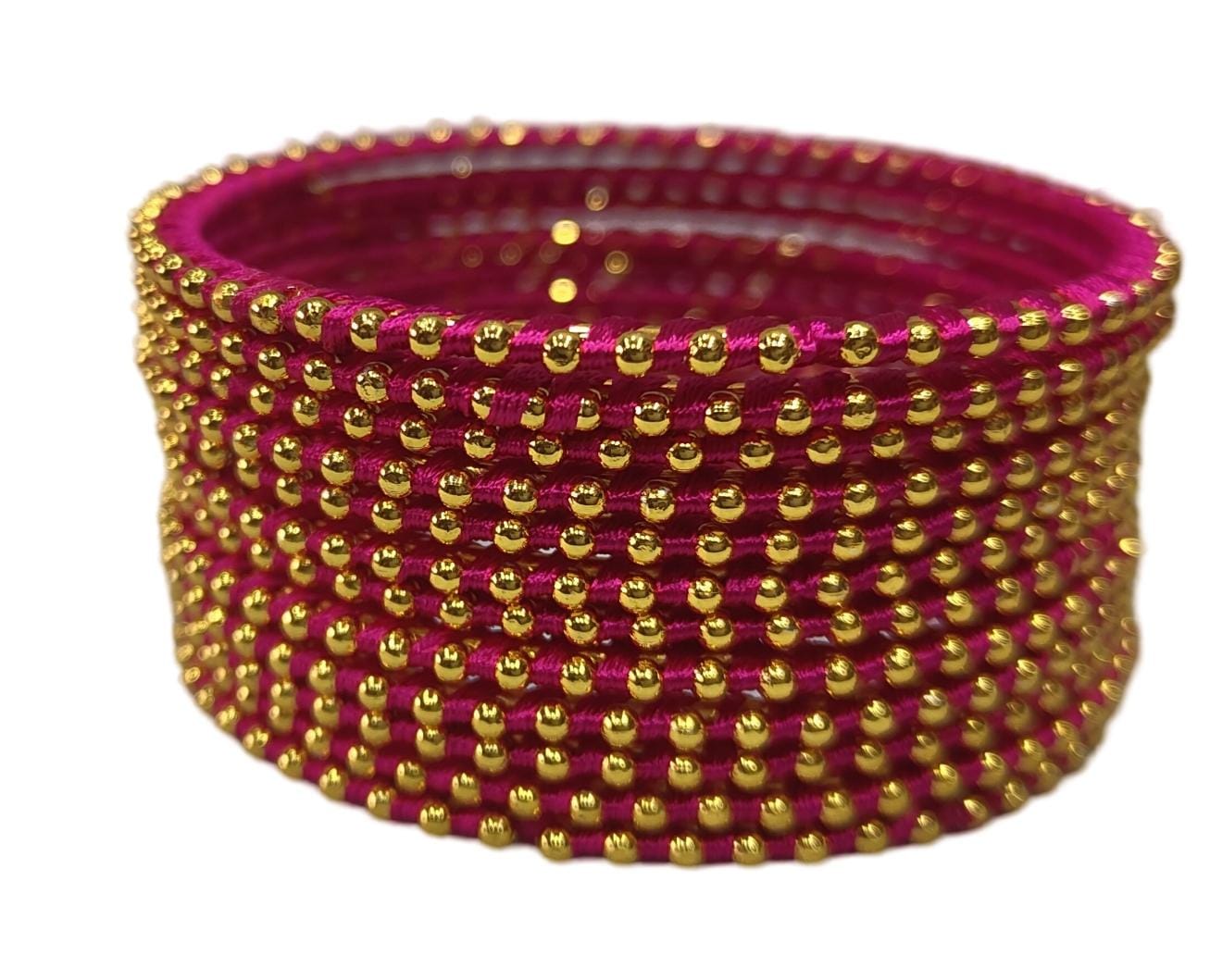 **Set of 8 bangles, pink color with golden beads, traditional Indian jewelry, perfect for weddings and festivals.