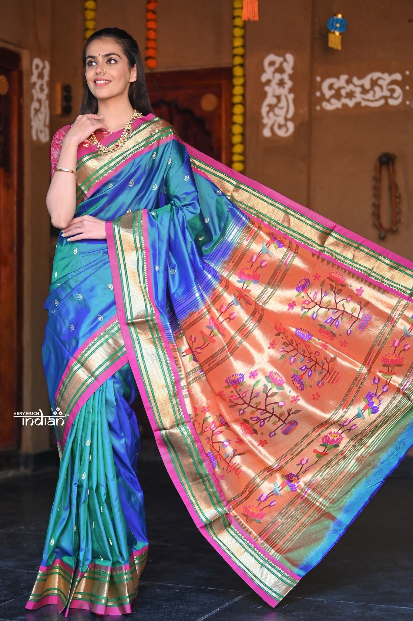 Raaga Heritage Traditional Handloom Pure Silk  Peacock Blue Paithani with Exclusive Floral Pallu and Chandrakor Buttis