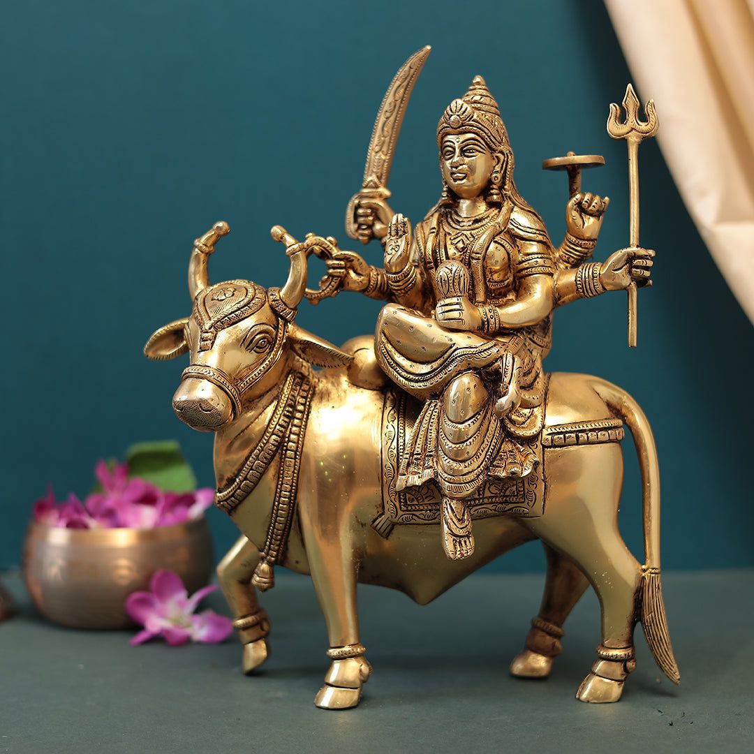 Brass Goddess Durga Seated On Cow In 13 Inches (33 Cm)-H*L*W = 13*10.5*5 Inches (33*26.5*12.5 Cm) / Brass