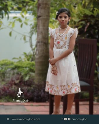 Whispering Grace - White premium dobby cotton frock with net design Whispering Grace - White premium dobby cotton frock with net design