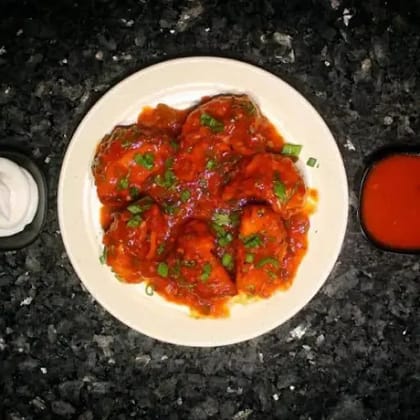 Schezwan Gravy Veg Momos