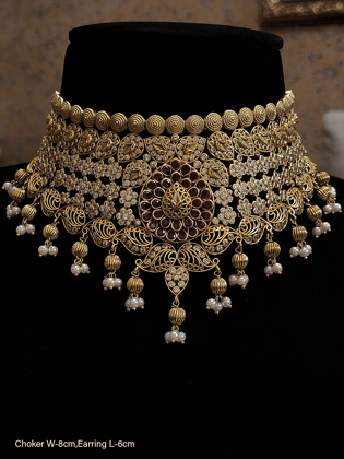 Polki studded paisley design broad choker set with green stones leaf in the center-Ruby
