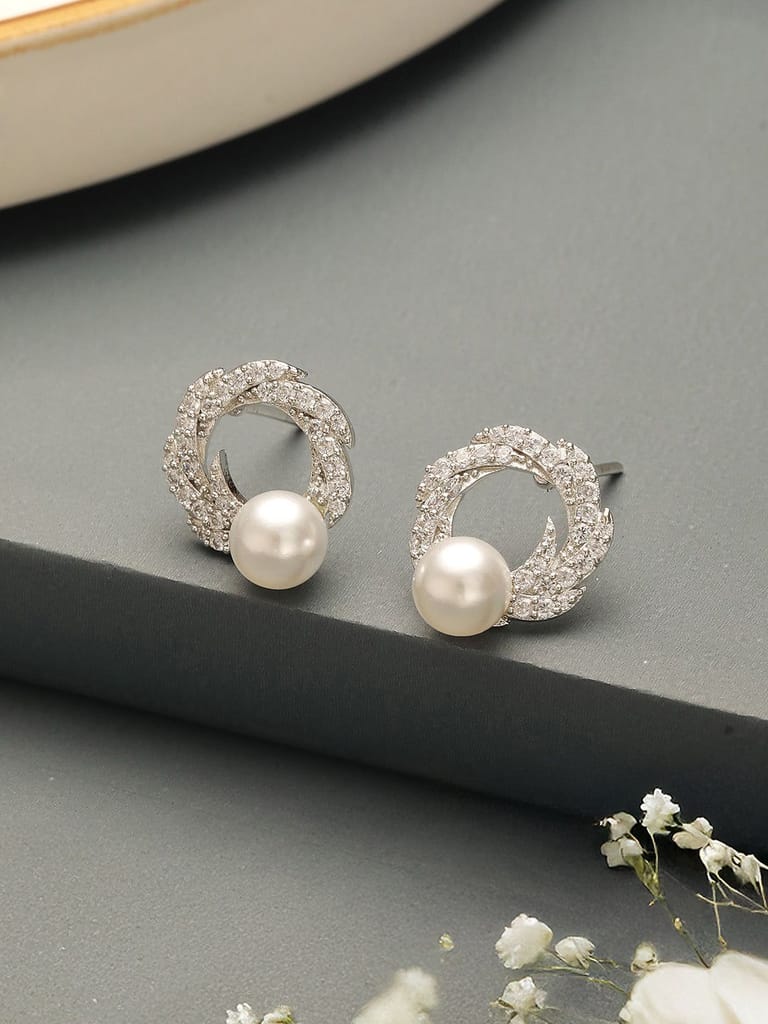 Silver Plated AD & Pearl Studded Floral Minimal Contemporary Studds earrings - Earrings | Buy online on ZillyBuy