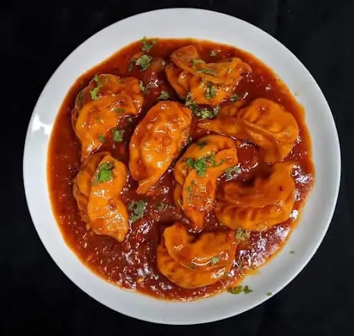 Paneer Schezwan Gravy Momos