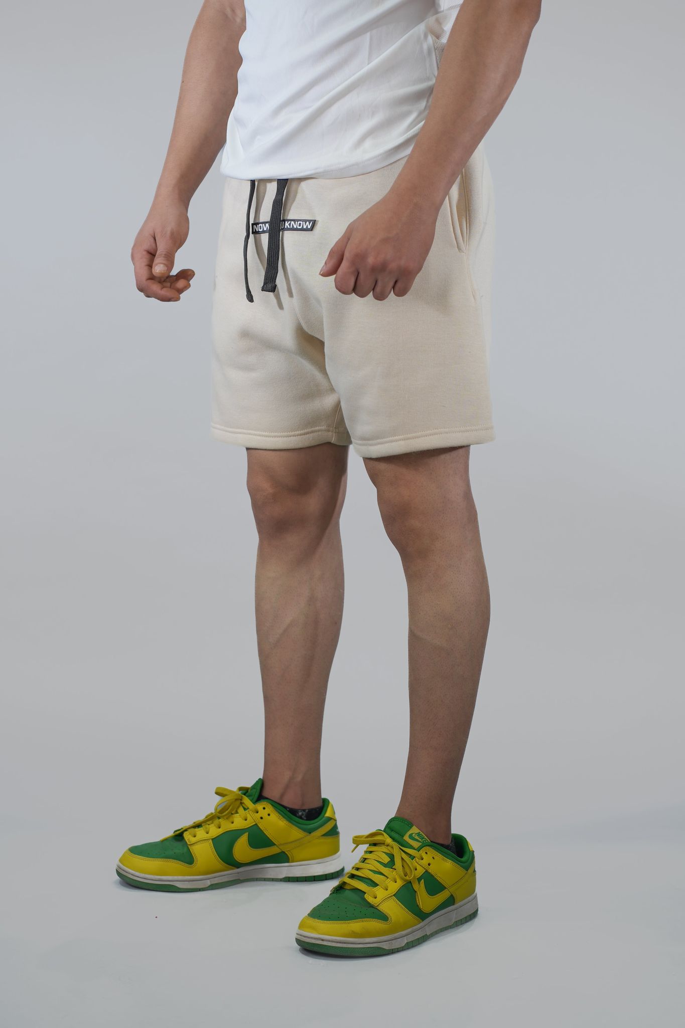 Cream Solid Relaxed Fit Shorts