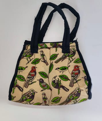 Kalankari cotton mini tote bag with red handles and a zipper closure featuring a colorful bird and leaf print.