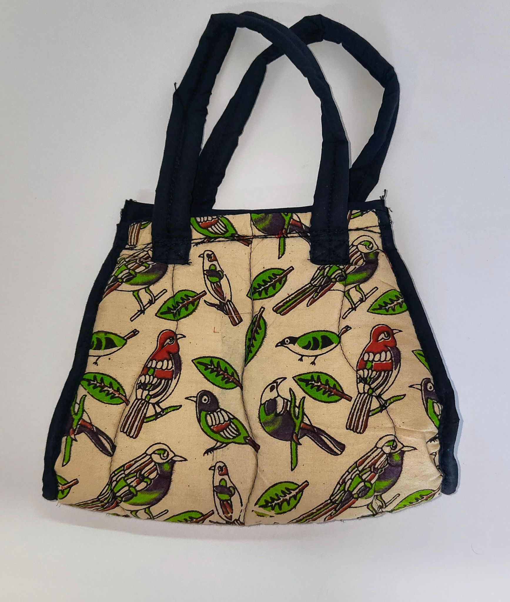 Kalankari cotton mini tote bag with red handles and a zipper closure featuring a colorful bird and leaf print.