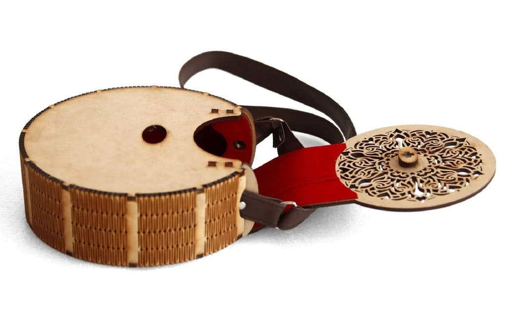 "Exquisite Handcrafted Circular Wooden Handbag with Intricate Floral Design – Perfect Rakhi Festival Gift"