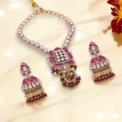 Gold-Plated Lotus Motif Necklace Set with Ruby Accents, Jhumka Pendant, and Matching Earrings