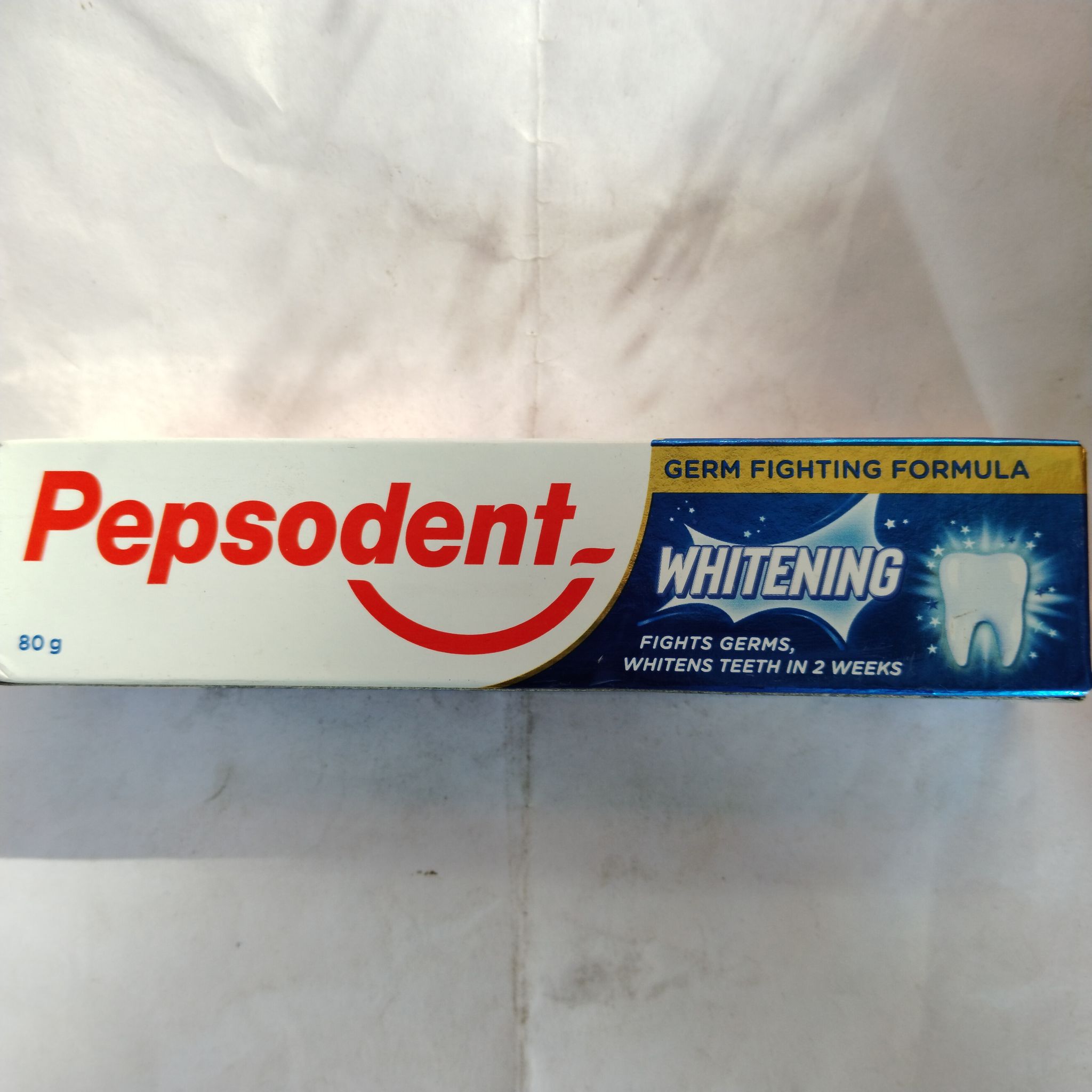 Pepsodent whitening Fights germs, Whitens teeth in 2 weeks 