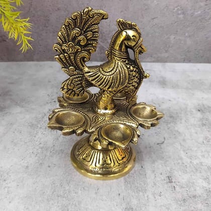 Brass Peacock Five Wick Diya - 6.5 inch Height | Brass Diya with Peacock Design for Festivals Brass Peacock Five Wick Diya - 6.5 inch Height | Brass Diya with Peacock Design for Festivals