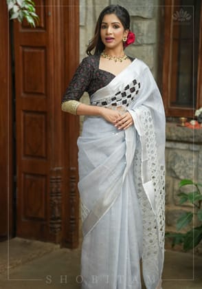 Silver Cutwork and Mirror Work Tissue Linen Saree in White Silver with dramatic tassels