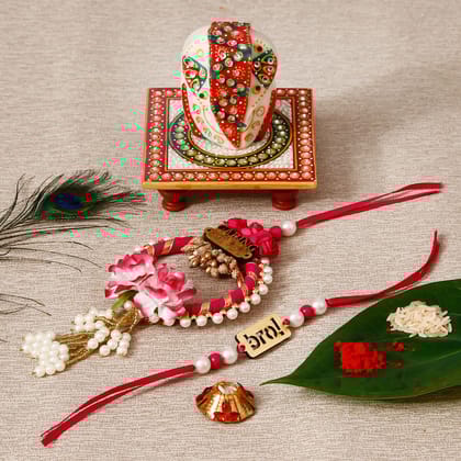 Designe Bhaiya Bhabhi Rakhi with Lord Ganesha on Kundan Studded Marble Chowki and Roli Tikka Matki