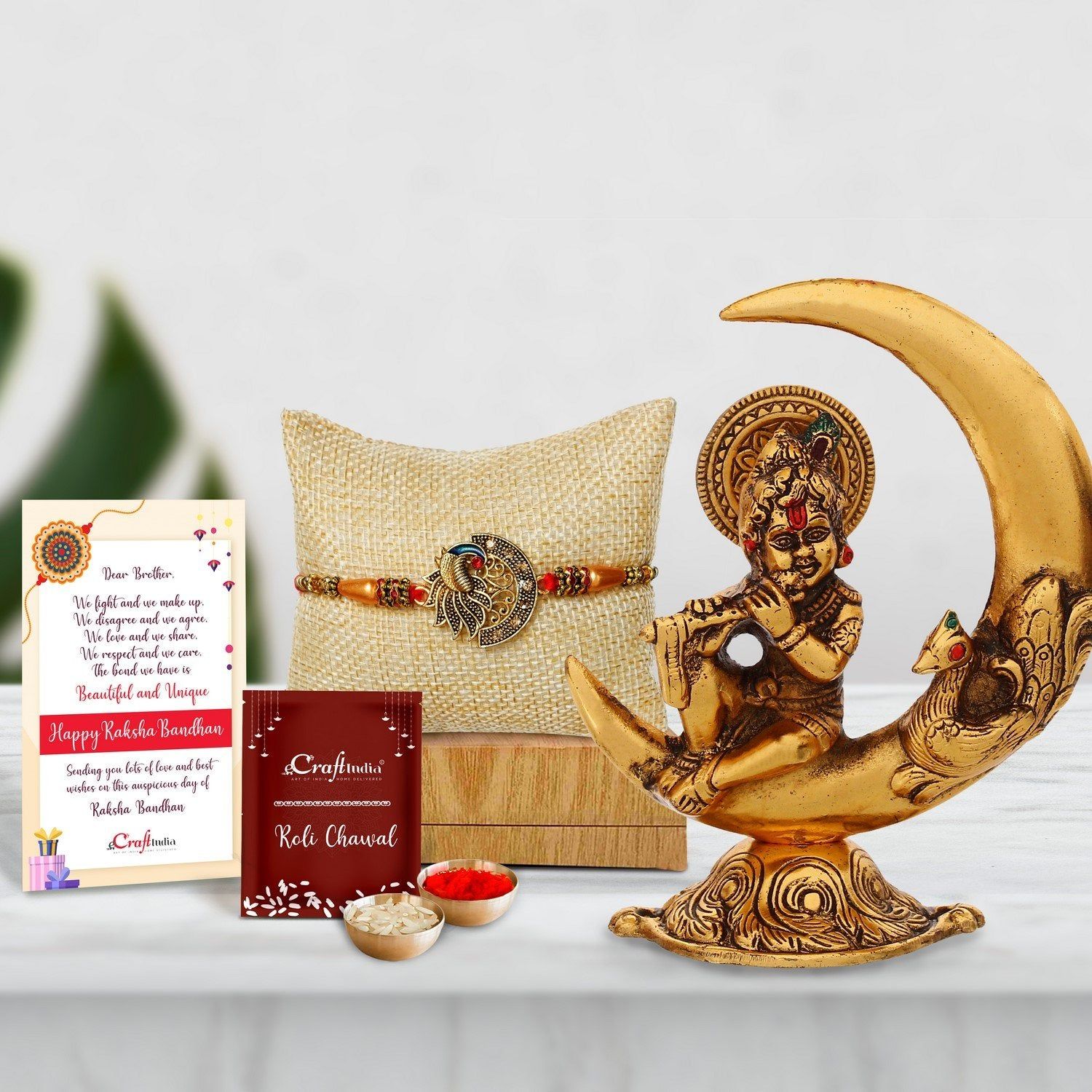 Designer Peacock Rakhi with Golden Lord Krishna Idol Metal Decorative Showpiece and Roli Chawal Pack, Best Wishes Greeting Card