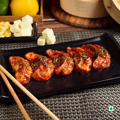 Corn Cheese Pan Fried Momo In Tomato Garlic Sauce