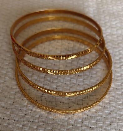 Gold Plated Bangles Embrace the Shimmering Elegance