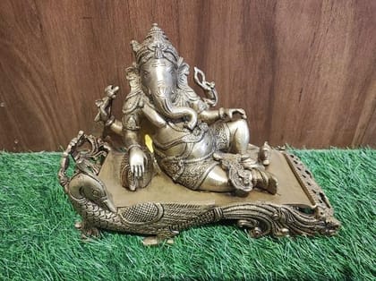 BRASS GANESHA RESTING ON PEACOCK SINGHASAN BRASS GANESHA RESTING ON PEACOCK SINGHASAN