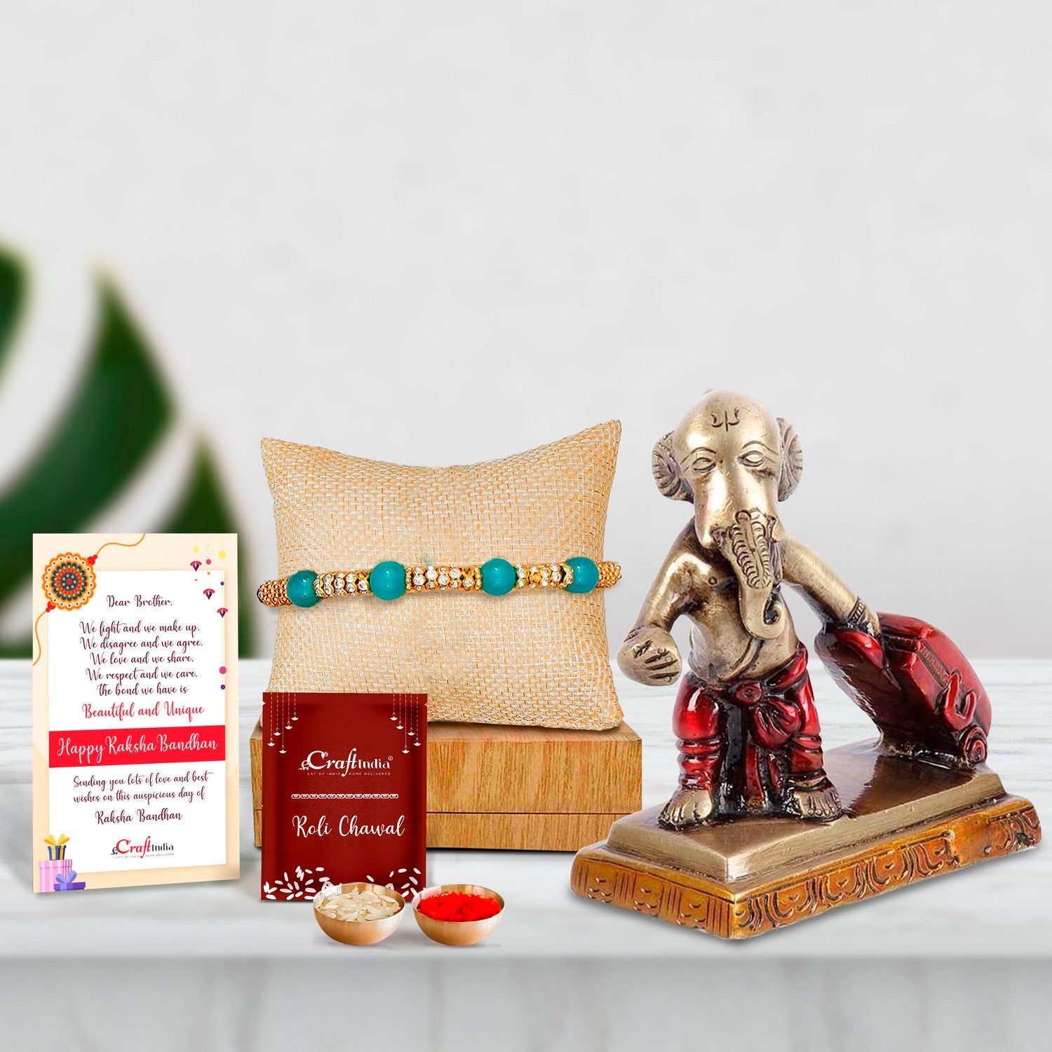 Designer Pearl Rakhi with Brass Ganesha Carrying Happiness around the world Antique Showpiece and Roli Chawal Pack, Best Wishes Greeting Card
