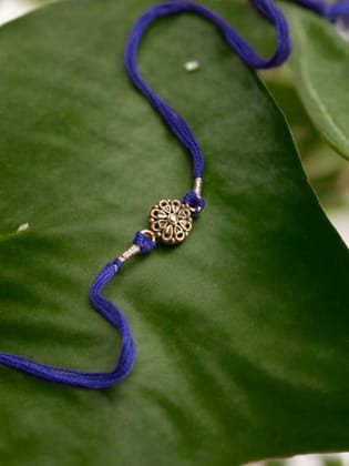 Auspicious Flower Silver Rakhi