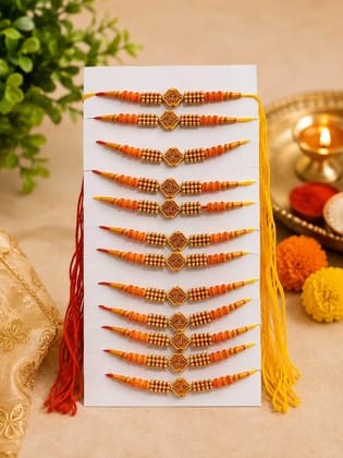 Celebrate Raksha Bandhan with this elegant set of 12 lotus design rakhis. Featuring pearl-like beads, yellow accents, and red-yellow threads for a festive tradition