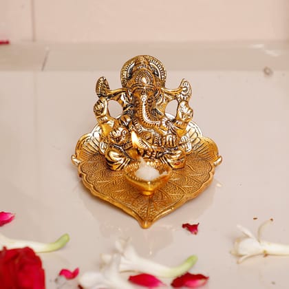 DreamKraft Metal Lord Ganesha On Leaf with Diya Idol