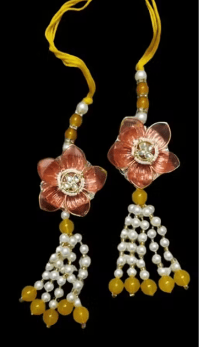 Traditional Floral Pearl Lumba Rakhi Set Celebrate the special bond with this exquisite Lumba