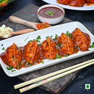 Veg Pahari Feast Pan Fried Momo In Tomato Garlic Sauce
