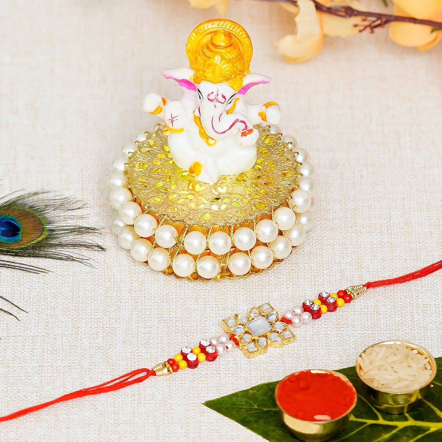Designer Stone Work Rakhi with Lord Ganesha Idol on Decorative Handcrafted Plate for Home and Car and Roli Chawal Pack