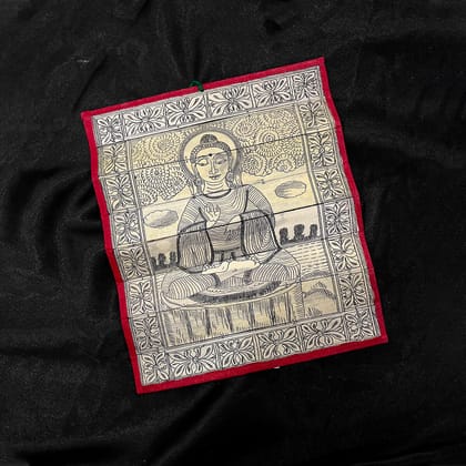 Palm leaf engraving of meditating Buddha