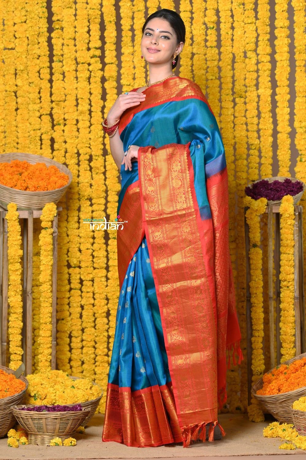 Rajsi~ Handloom Pure Silk Gadwal Saree Handcrafted Zari Pallu In Blue and Orange Border