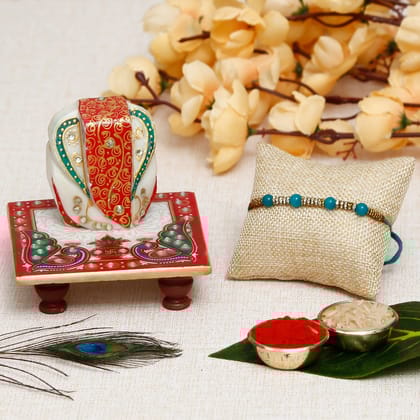 Designer Pearl Rakhi with Lord Ganesha on Marble Chowki and Roli Chawal Pack