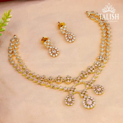 Gold-Plated Layered Necklace Set with Teardrop and Floral Shapes, Adorned with Sparkling American Diamond Stones