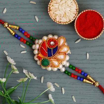 Multicolor Designer Peacock Pearl Rakhi and Roli Chawal Pack