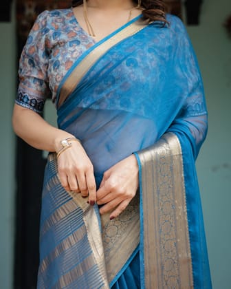 Vibrant Peacock Blue Plain Chiffon Saree with Gold Zari Border, Floral Printed Blouse & Tassel Accents-Regular