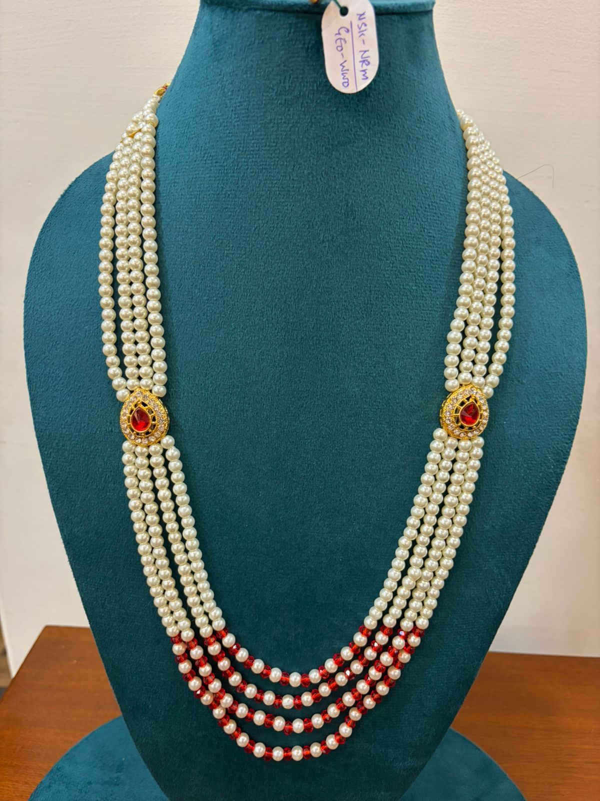 fancy design traditional pearl mala with red stone for party wear