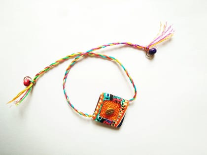 Orange Diamond Shaped Rakhi Orange Diamond Shaped Rakhi