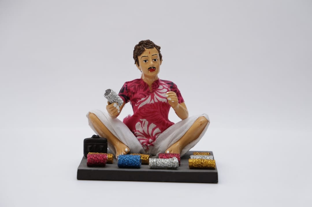 Village Worker (man selling bangles)